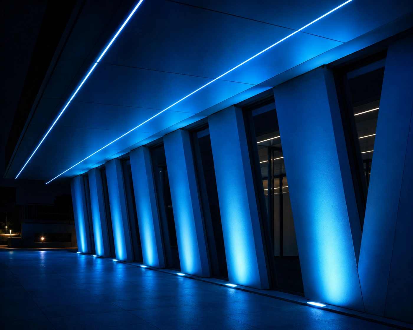 Blue illuminated architectural facade at night