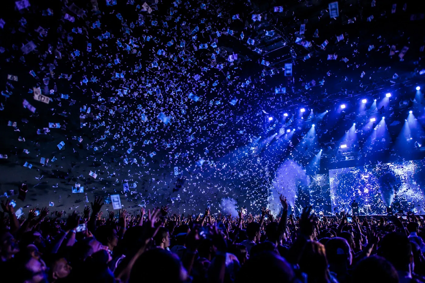 Confetti and lighting over a concert stage